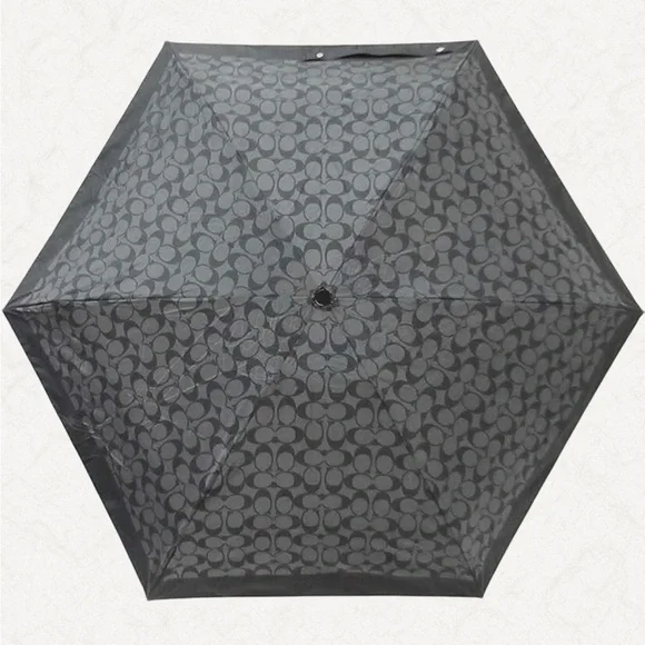 Coach UV Protection Signature Mini Umbrella, style number C4322.